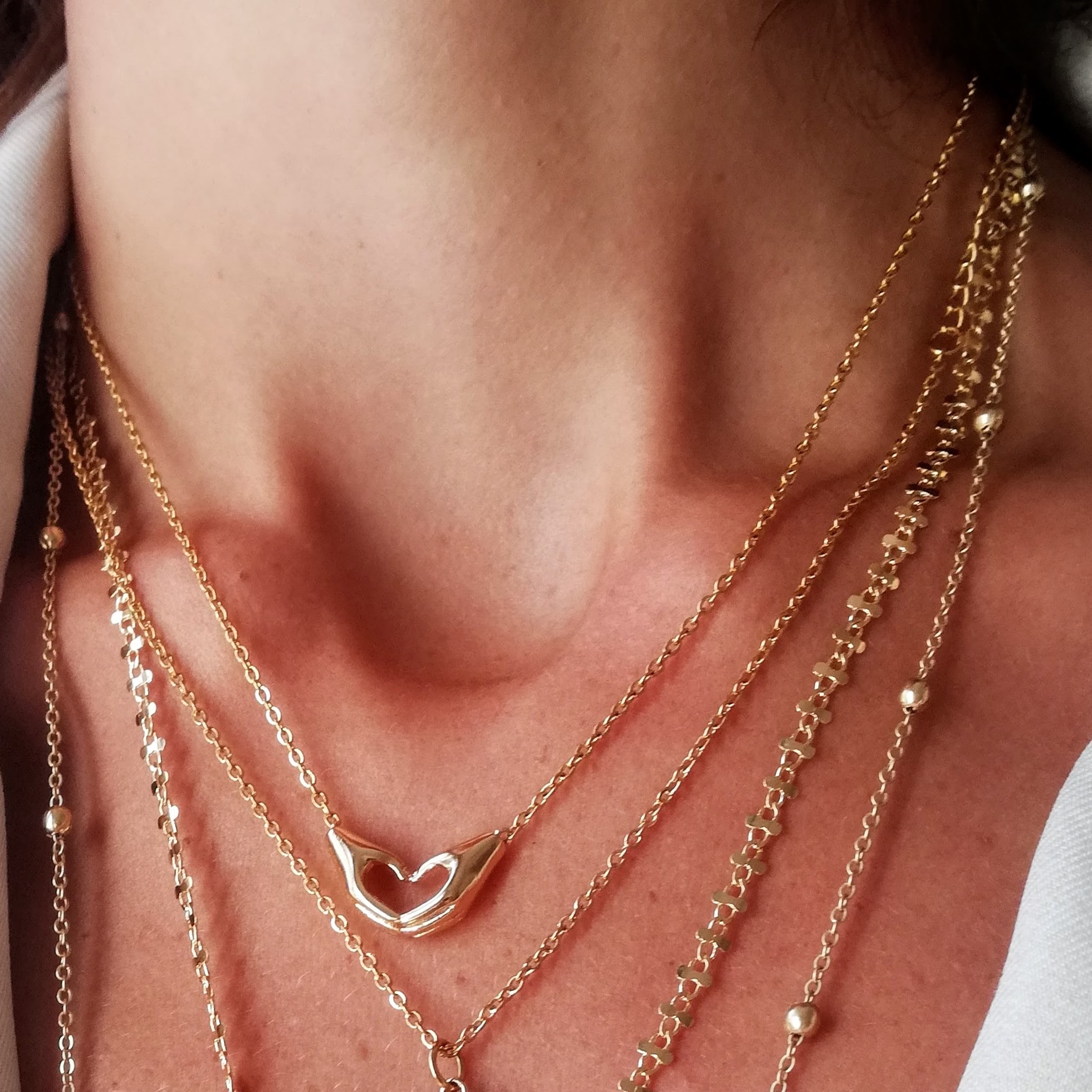 Collier cœur avec les mains or