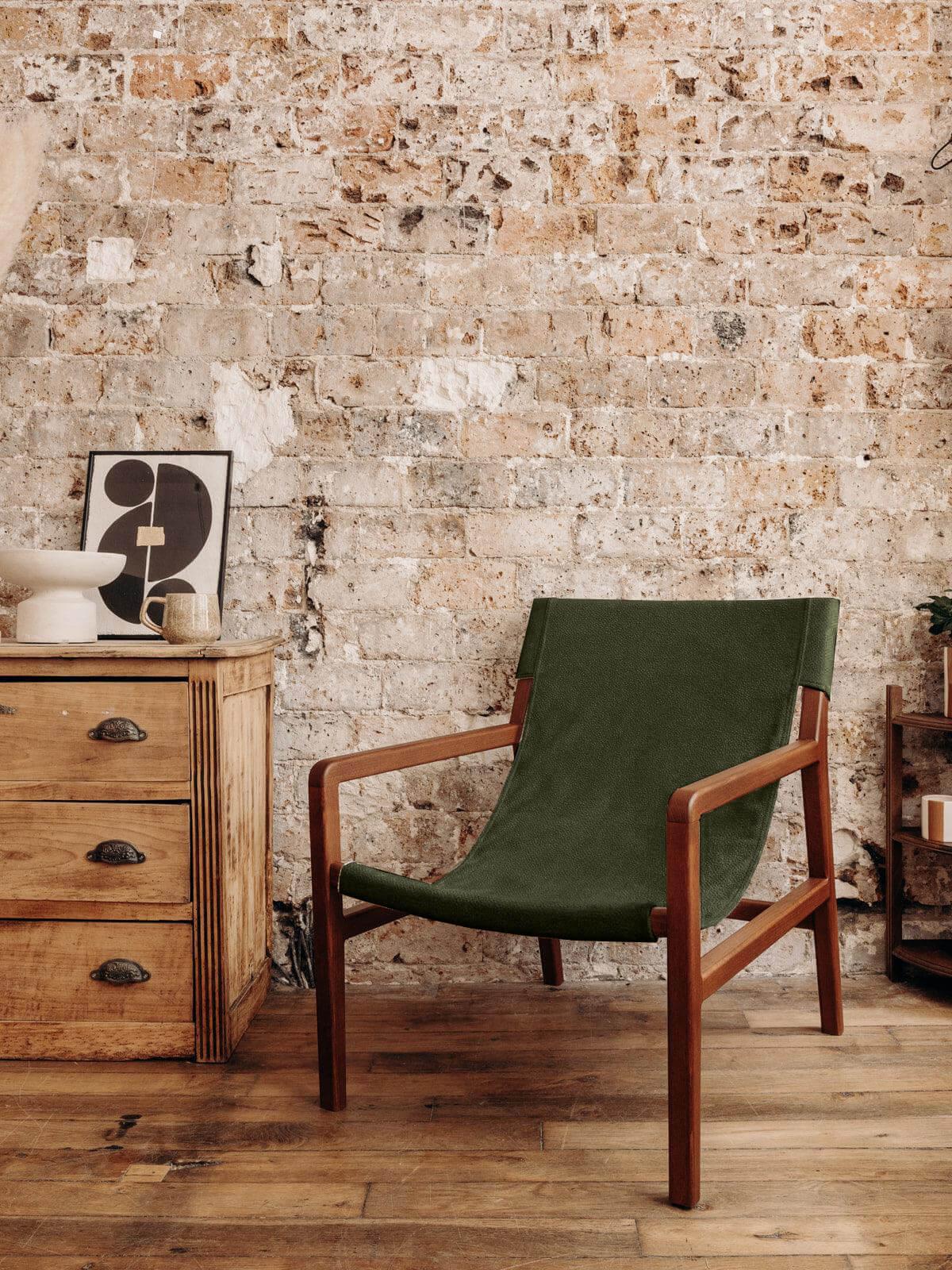 Le fauteuil en tissu bouclette vert